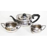 A three piece hallmarked silver tea set, gross weight 43oz.