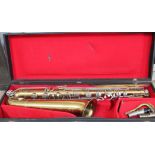 A Pennsylvania brass baritone saxophone with Buescher mouthpiece with hard case.