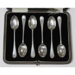 A cased set of six hallmarked silver teaspoons with shell scroll finials. Condition - good,