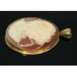 A hallmarked 9ct gold shell cameo pendant, length 45mm, gross weight 8.15g. Condition - hairline