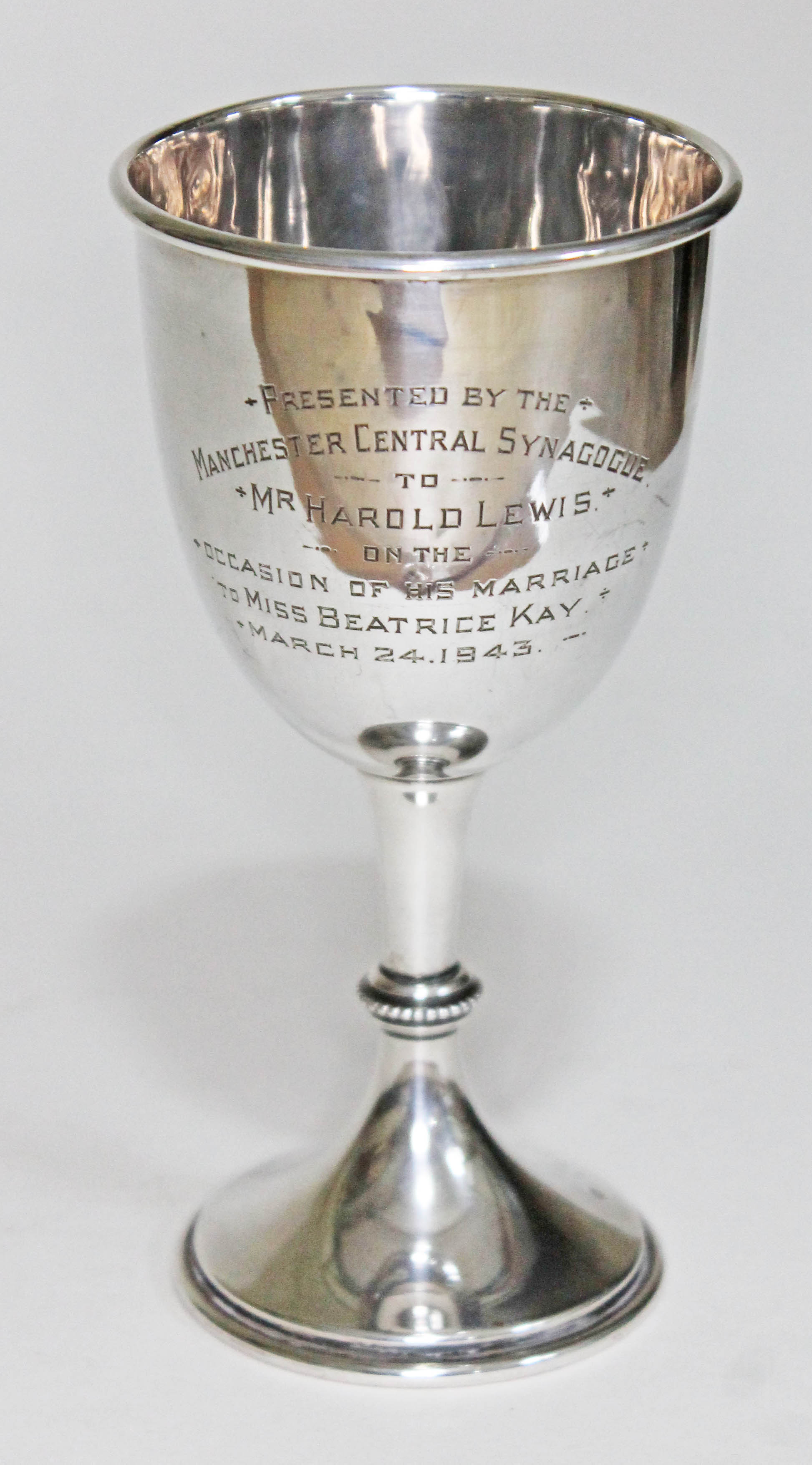 A hallmarked silver goblet inscribed 'Presented by the Manchester Central Synagogue to Mr Harold