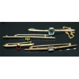 A group of four bar brooches, each set with coloured paste, all marked '9ct', gross wt. 9.04g,