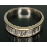 A half hoop diamond eternity ring, set with fifteen baguette cut diamonds, total approx. diamond