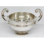 A hallmarked silver pedestal and twin handle bowl, length 16cm, weight 5oz. Condition - good,