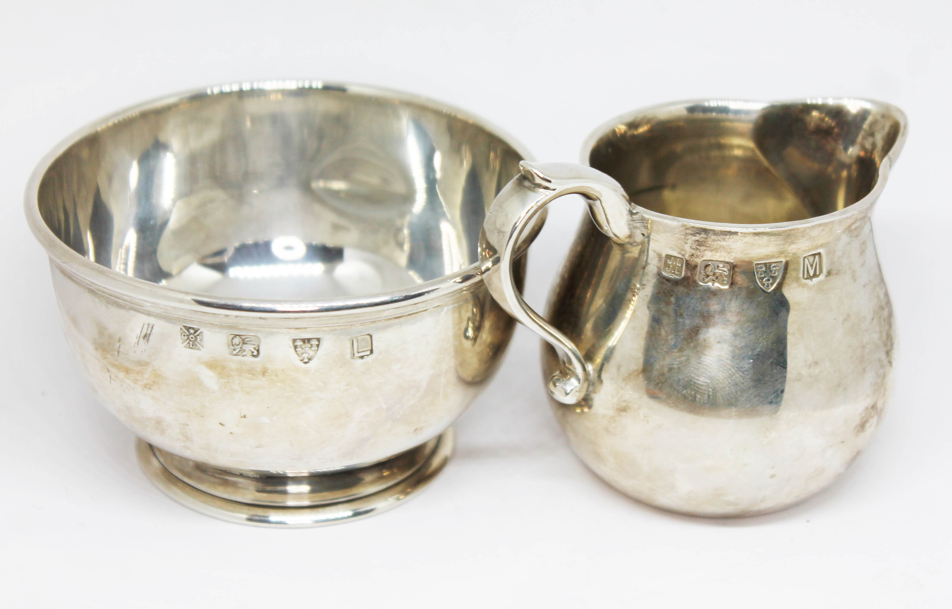 A matched hallmarked silver sugar bowl and cream jug, both marked 'Lowe Chester', weight 7 3/4oz.