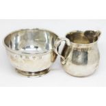 A matched hallmarked silver sugar bowl and cream jug, both marked 'Lowe Chester', weight 7 3/4oz.