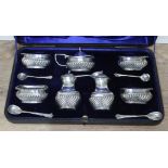 A cased hallmarked silver cruet set, approx. weight 9 1/2oz. Condition - two of the spoons are