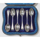 A late Victorian cased set of bright cut engraved hallmarked silver teaspoons. Condition - good,