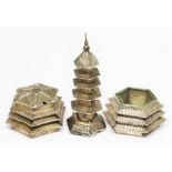 A Chinese three piece cruet, each piece modelled as a pagoda, marked 'Silver' with Chinese
