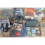 A quantity of vintage games consoles including Nintendo, Spectrum etc. various accessories and