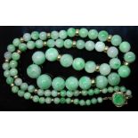 A single strand of graduated jadeite jade beads, ranging in diameter from 4mm to 11mm, spaced with