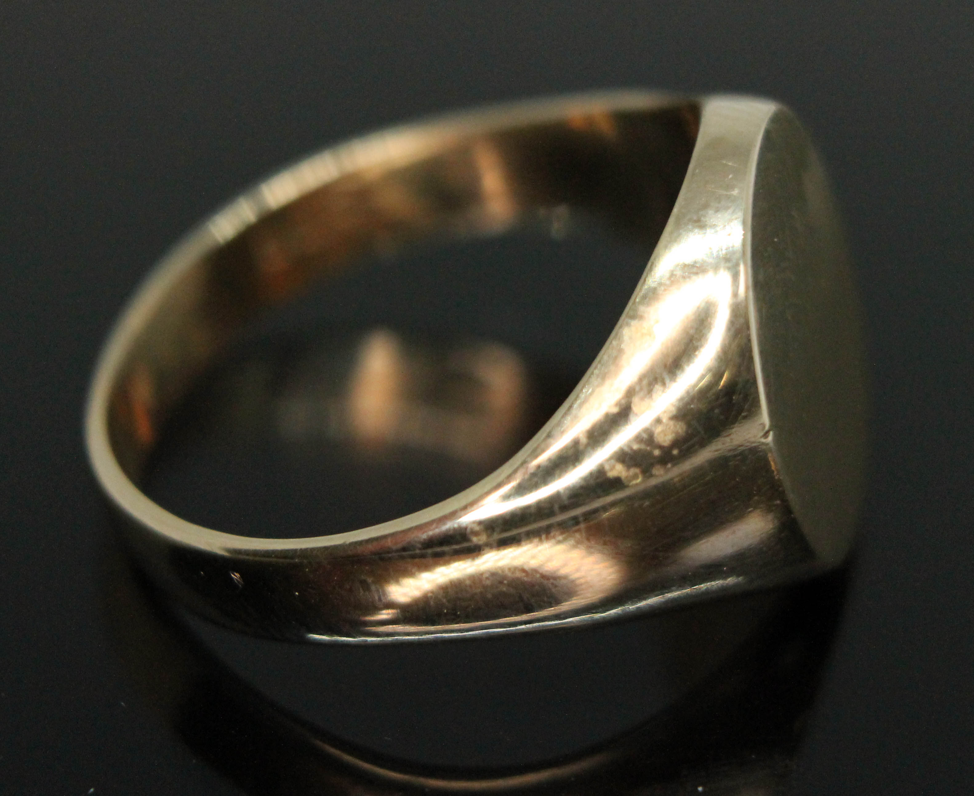 A hallmarked signet ring, wt. 9.77g, size W/X. Condition - marks rubbed but appears to be 9ct