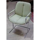 A Pieff "Eleganza" chrome elbow chair.
