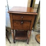 A Victorian mahogany bedside cabinet having drop down lower cabinet and interior marble shelf