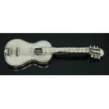 A novelty hallmarked silver guitar, length 75mm, weight 17.15g.