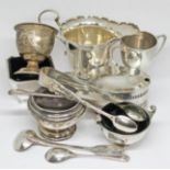 Assorted hallmarked silver including a cream jug, a mustard, sugar tongs, spoons, condiments etc.