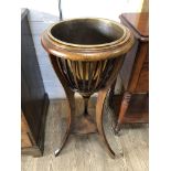 A Victorian basket jardinier stand with brass liner, height 88cm, diam of liner 27.5cm.