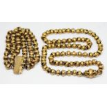 A 19th century textured large link necklace and matching three strand bracelet, lengths 66cm & 18cm,