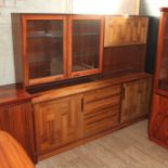 A Swedish Brazilian rosewood sideboard by Troeds, the top section with glazed left cabinet with