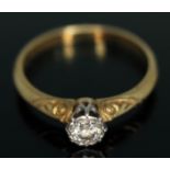 A diamond solitaire ring, the bezel set modern round brilliant diamond weighing approx. 0.20 carats,