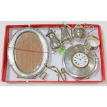 Assorted hallmarked silver comprising a photograph frame, a clock, a cruet, a serviette ring and a
