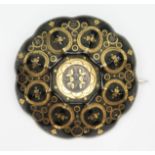 A Victorian pique inlaid tortoiseshell target brooch, marked 'JS' to reverse, diam. 37mm.