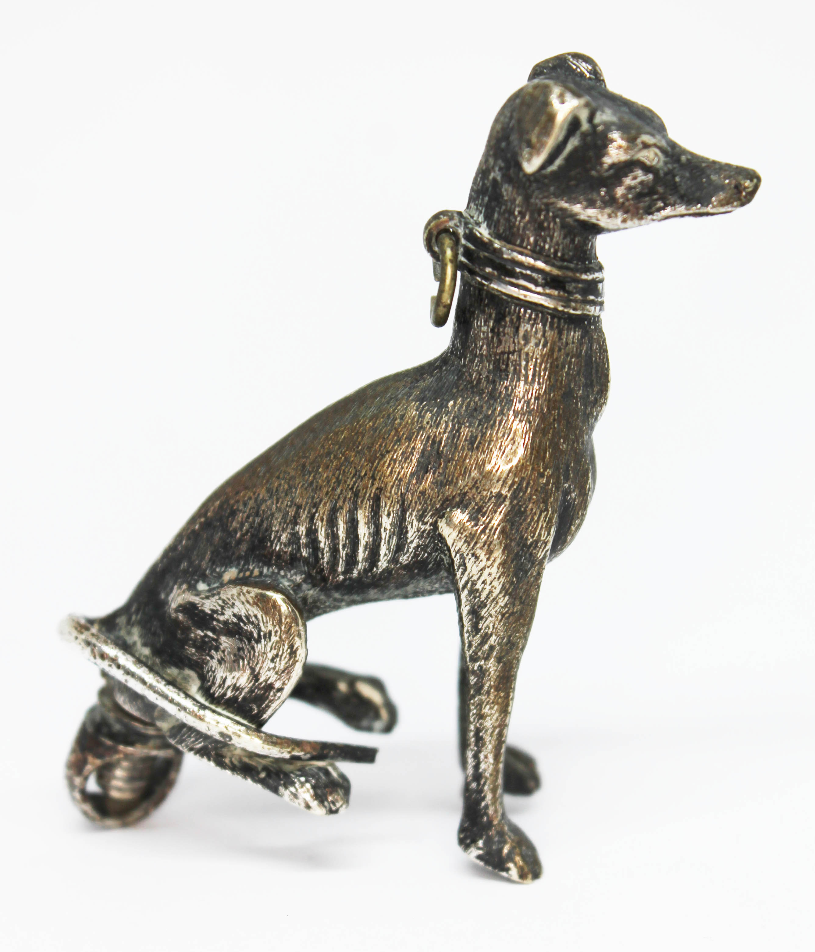 A silver plated finial modelled as a grey hound, with screw fitting and nut, length 75mm.