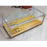 A Merrow Associates Brazilian rosewood, glass top and chrome framed oblong coffee table, length