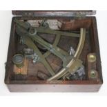 An antique brass nautical sextant by D McGregor & Co, Glasgow, fitted in mahogany case.