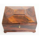 A 19th century rosewood box of sarcophagus form with bun feet and ivory escutcheon, width 28cm,