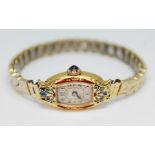 An early 20th century French 18ct gold and enamel inlaid ladies 15 jewel manual wind wristwatch, the