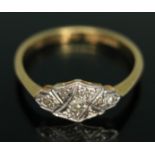 An Art Deco three stone diamond ring, the head measuring approx. 12mm x 6mm, band marked '18ct