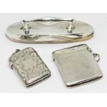 Two hallmarked silver vesta cases and a hallmarked silver mounted nail buffer.