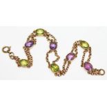 A amethyst and peridot set bracelet, indistinctly marked, gross weight 5.83g, length 19cm. Condition