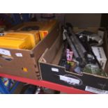 A box of Kodak slide carousels and a box of camera equipment to include tripod, movie camera, etc.