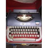 A Beaucourt Script portable typewriter.