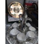 White metal Arabic tea set and an etched metal wall plate depicting Roman archeological sites in