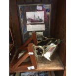 A antique brass ship's bell on wooden support from S.S. "Umvolosi" with additional letter and framed