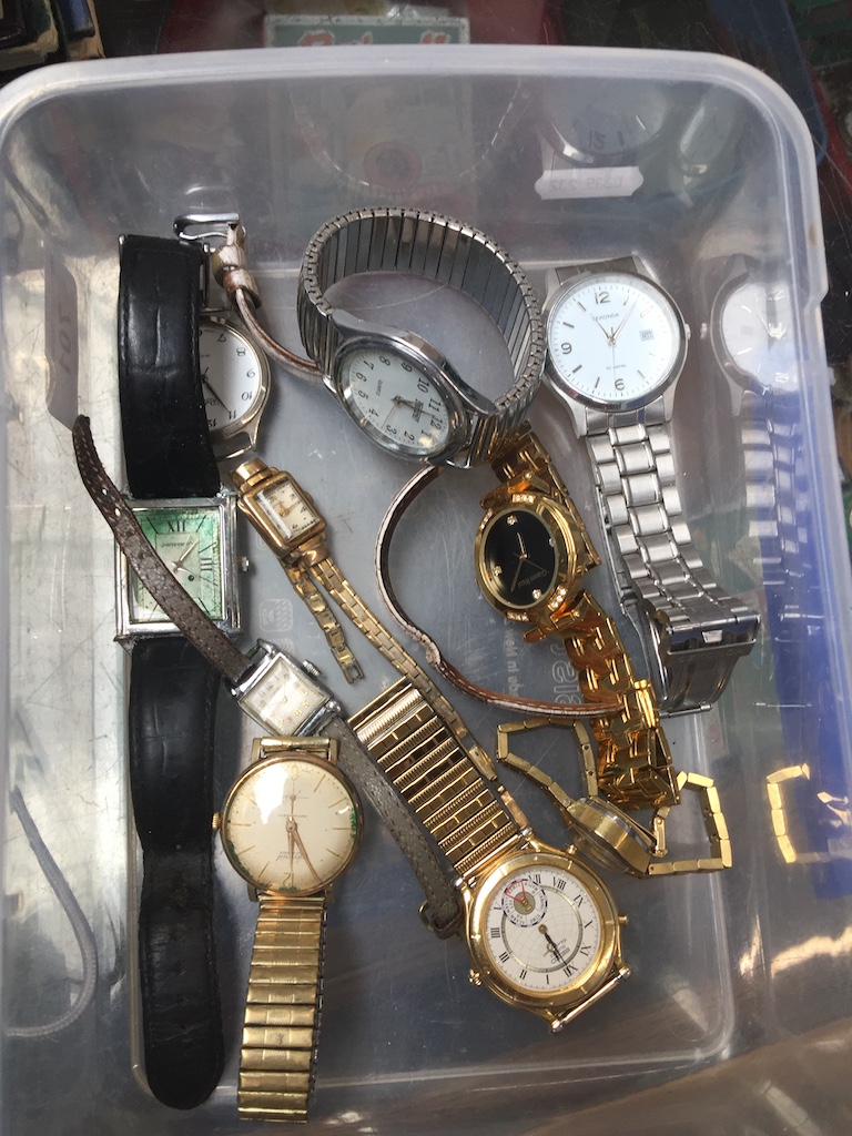 A tub of wristwatches