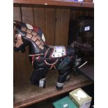 A decorative wooden carved and hand painted horse.