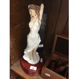 A vintage 'BonnyBoy' figure of a lady on wooden plinth.