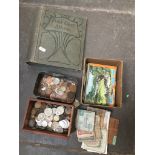 Box of coins, box of notes and some postacrds and an empty album