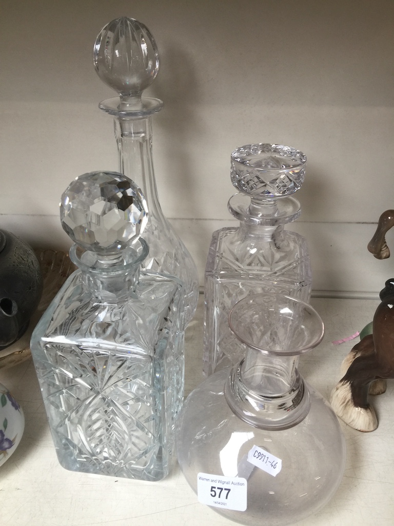 Four glass decanters, 3 with stoppers