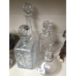 Four glass decanters, 3 with stoppers