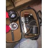 A case of assorted photographic equipment including lenses
