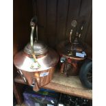 Two large copper kettles