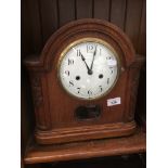 An oak cased German bracket clock