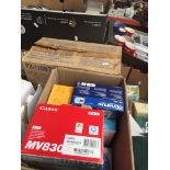 A box of cameras and related items including Canon MV830, Olympus FE100, etc.
