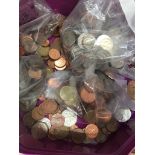 A tub of coins - Euros, Canadian & American Dollars