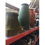 A pair of terracotta bell shaped chimney pots and another.